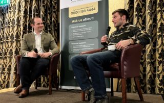 Guy Martin engaging in an interview-style discussion with Henry Bennett-Gough.