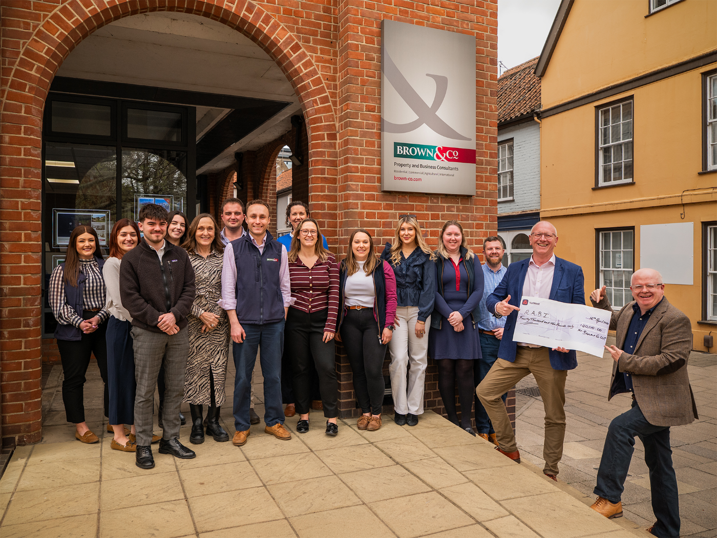 Photo of the Brown & Co team and Paul Pirie, RABI's Head of Fundraising, with the cheque