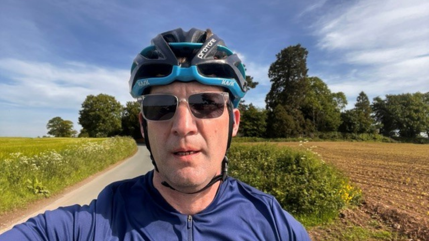 Justin Young on his challenge, wearing his cycling helmet.