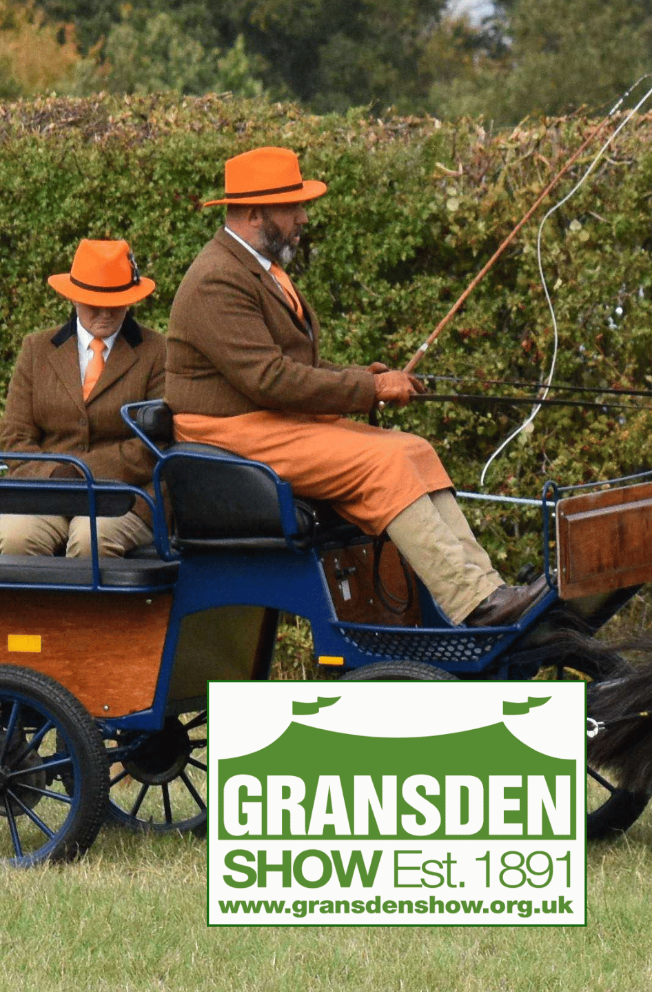 rabi-gransden-show-2026 Two people in traditional show attire driving a horse-drawn carriage at the Gransden Show, with the event logo displayed in the foreground.