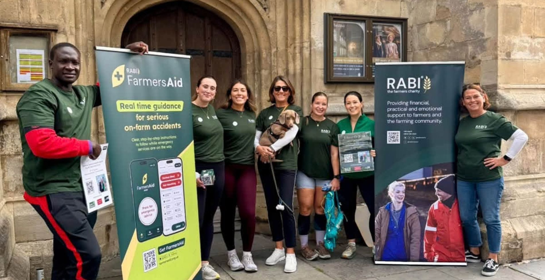 rabi-edwards-group-photo-1. Group standing with RABI clothing and signs