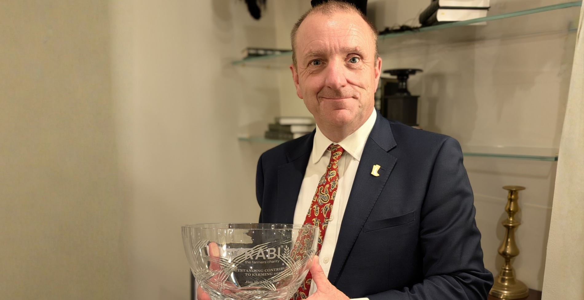 Jim McLaren MBE holding his RABI Outstanding Contribution to Farming 2026 award.